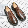 Men's black and brown business brogue shoes with round toe and brogue detailing.