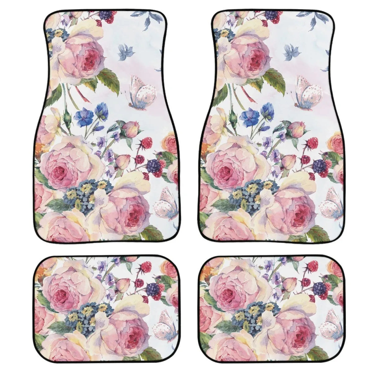 Four-piece set of thick black rubber car floor mats with printed patterns laid out for a vehicle.
