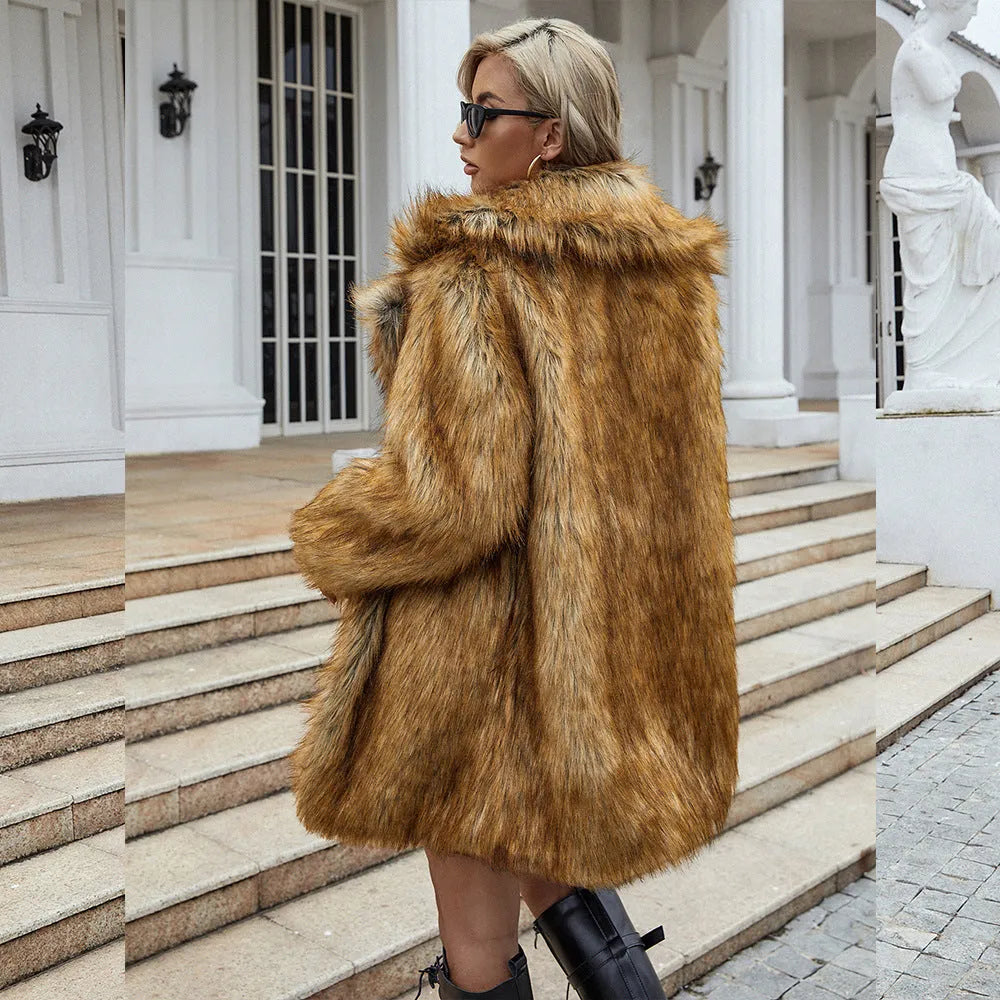 Yellow loose-fitting women's faux fur coat with regular sleeves on a hanger