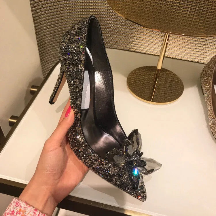 Women's gold pointed toe high heels with rhinestone detail and stiletto heel