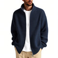 Man wearing a loose-fit grey cardigan sweater coat for casual leisure wear.
