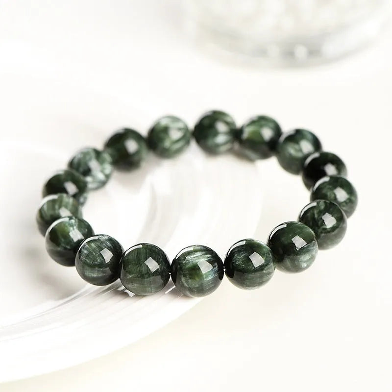 Green dragon crystal bracelet with 8-9mm round beads featuring geometric and Ruyi designs