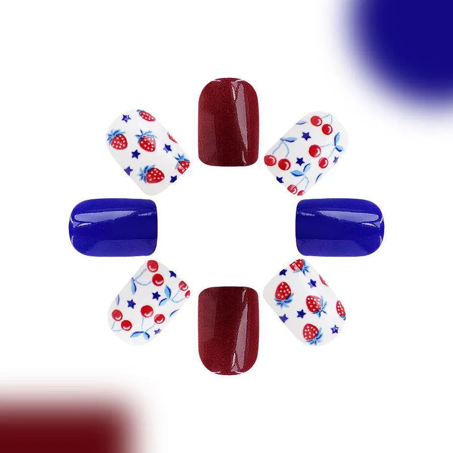 Short glossy red and blue nail stickers with strawberry and cherry pattern, 24 pieces.