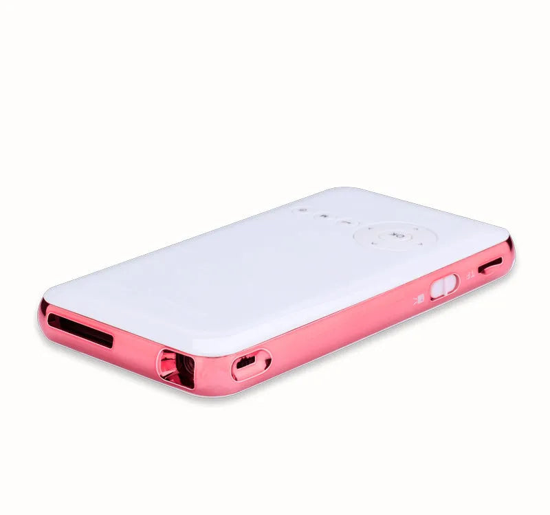 White and rose gold M6S miniature portable DLP Android projector with 32GB memory on a table.