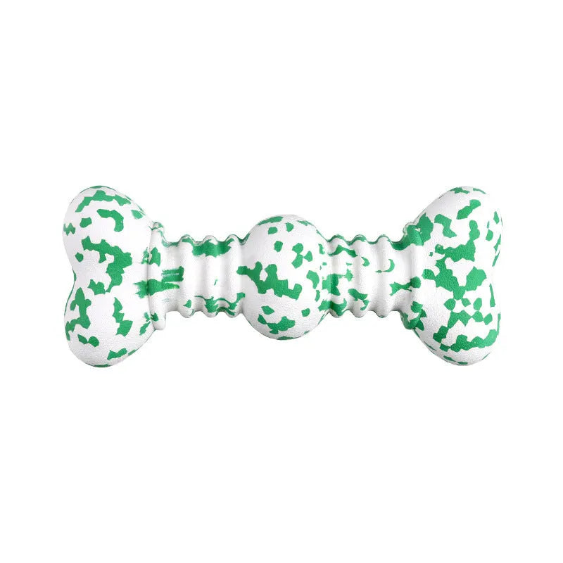 Green and white camouflage patterned natural rubber bone chew toy for dogs on a wooden floor.