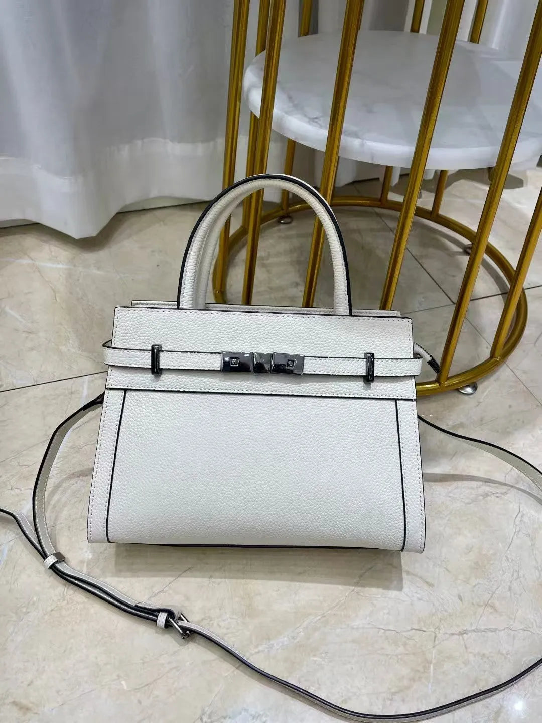 Small square genuine leather shoulder bag in horizontal design with multiple internal compartments