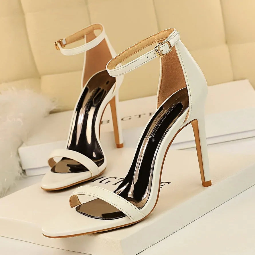 Open toe ankle strap high heels in artificial PU leather with buckle fastening