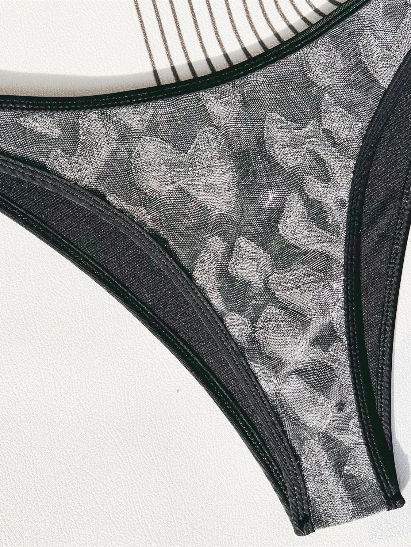 Ladies black bikini strap swimsuit in polyester fabric for swimming activities