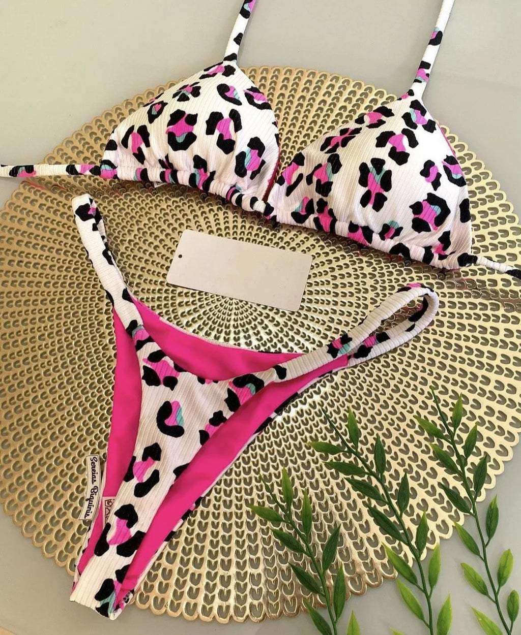 Women's bikini swimsuit with printed fabric in briefs style, showing high elasticity and cotton lining