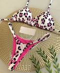 Women's bikini swimsuit with printed fabric in briefs style, showing high elasticity and cotton lining