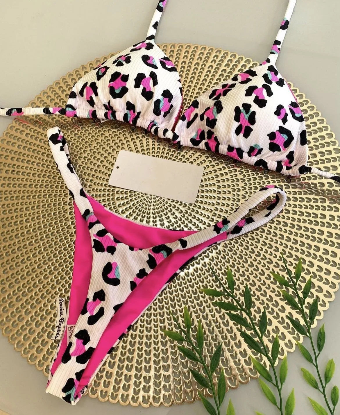 Women's bikini swimsuit with printed fabric in briefs style, showing high elasticity and cotton lining