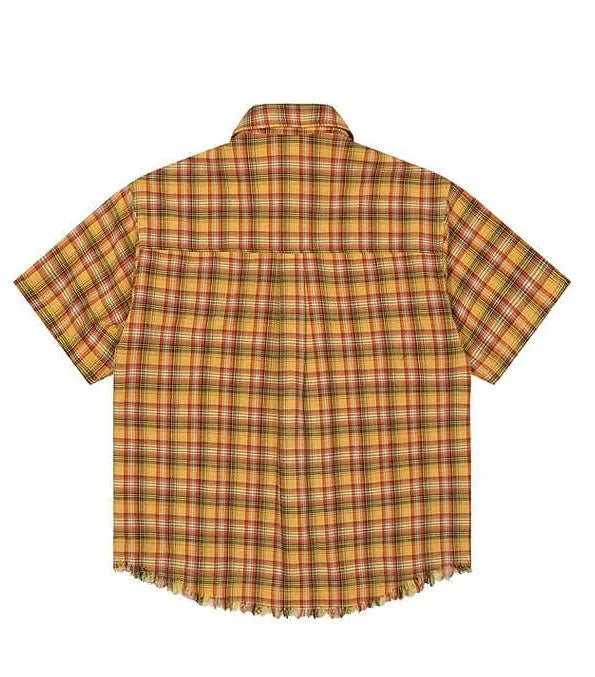Yellow and white plaid short sleeve shirt with embroidered chest pocket on a hanger.