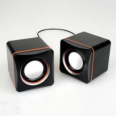 Small black square computer speaker with USB cable for PC connection