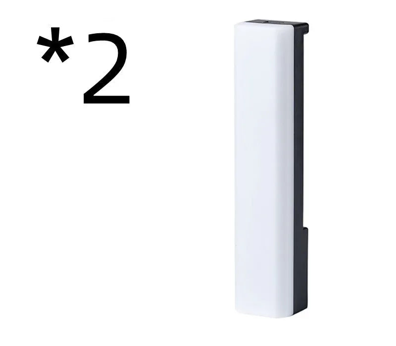 Black and white 3D RGB voice-activated music rhythm ambiance lamp on a tabletop.