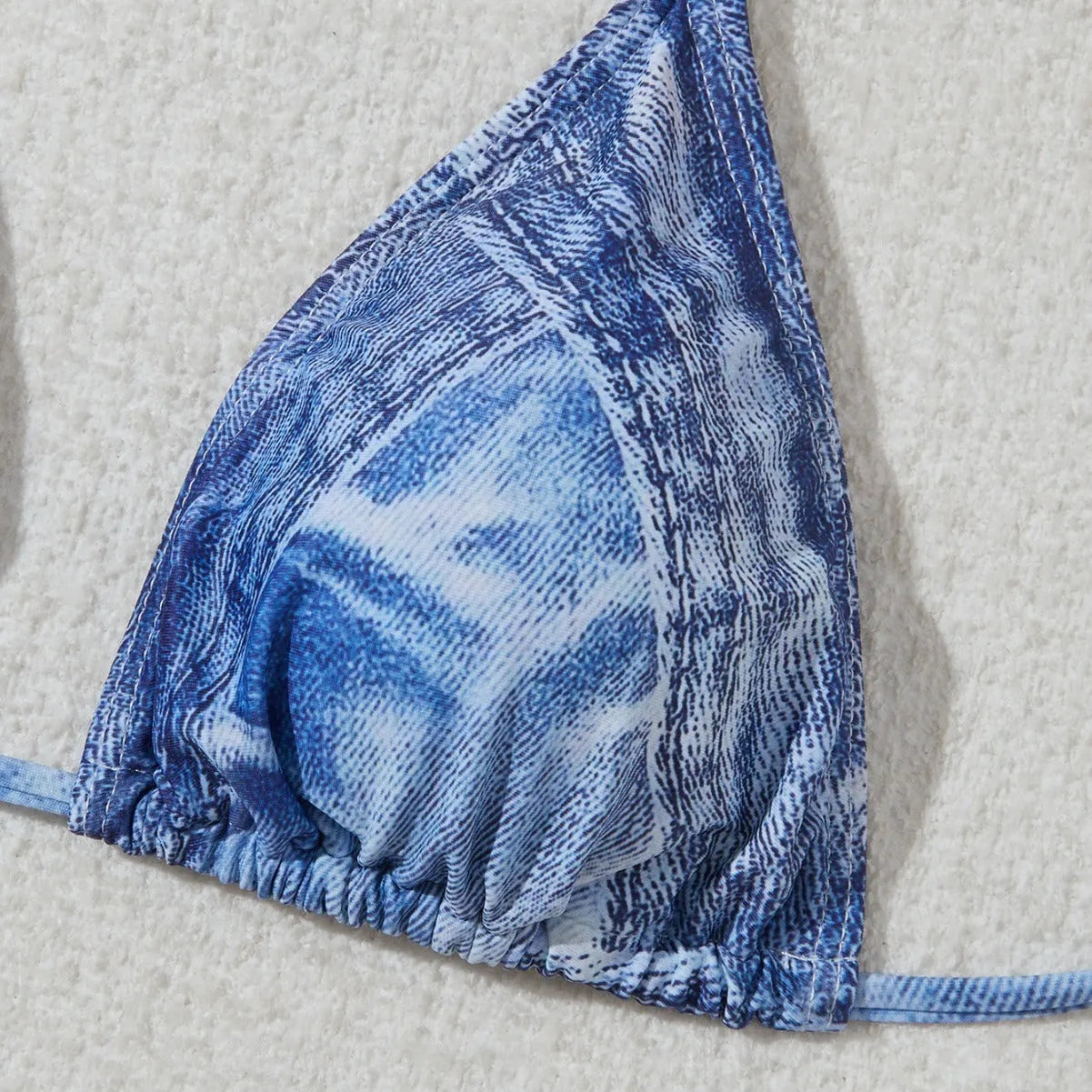 Women's blue denim print strappy bikini set, two-piece swimsuit on a white background.