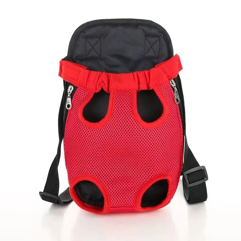 A small dog sitting in a breathable mesh carrier backpack worn on a person's front.