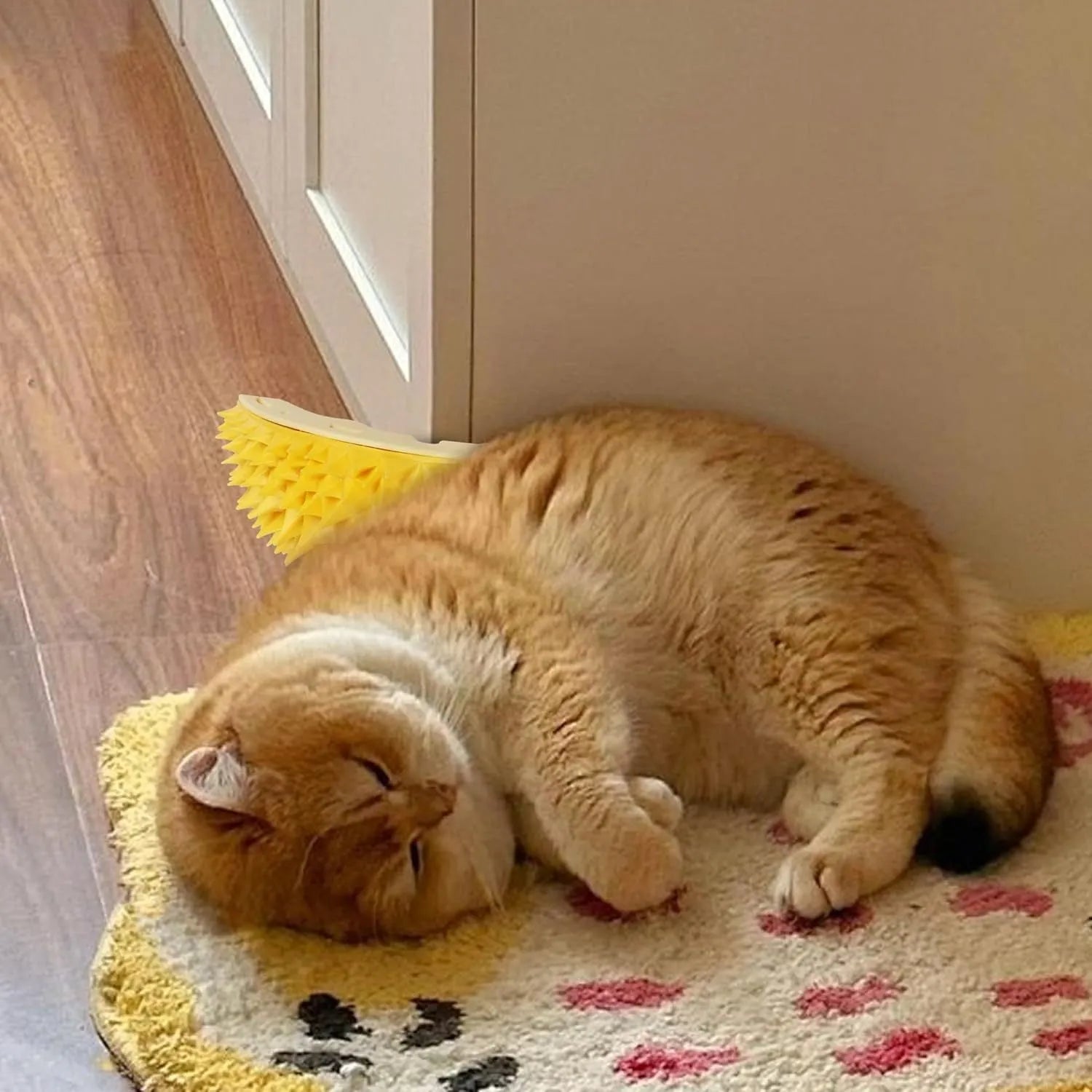 Yellow durian-shaped cat corner scratcher and grooming comb with adhesive backing