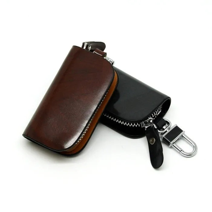 Genuine leather car key case in frost black and brown, showing soft cowhide material and size.