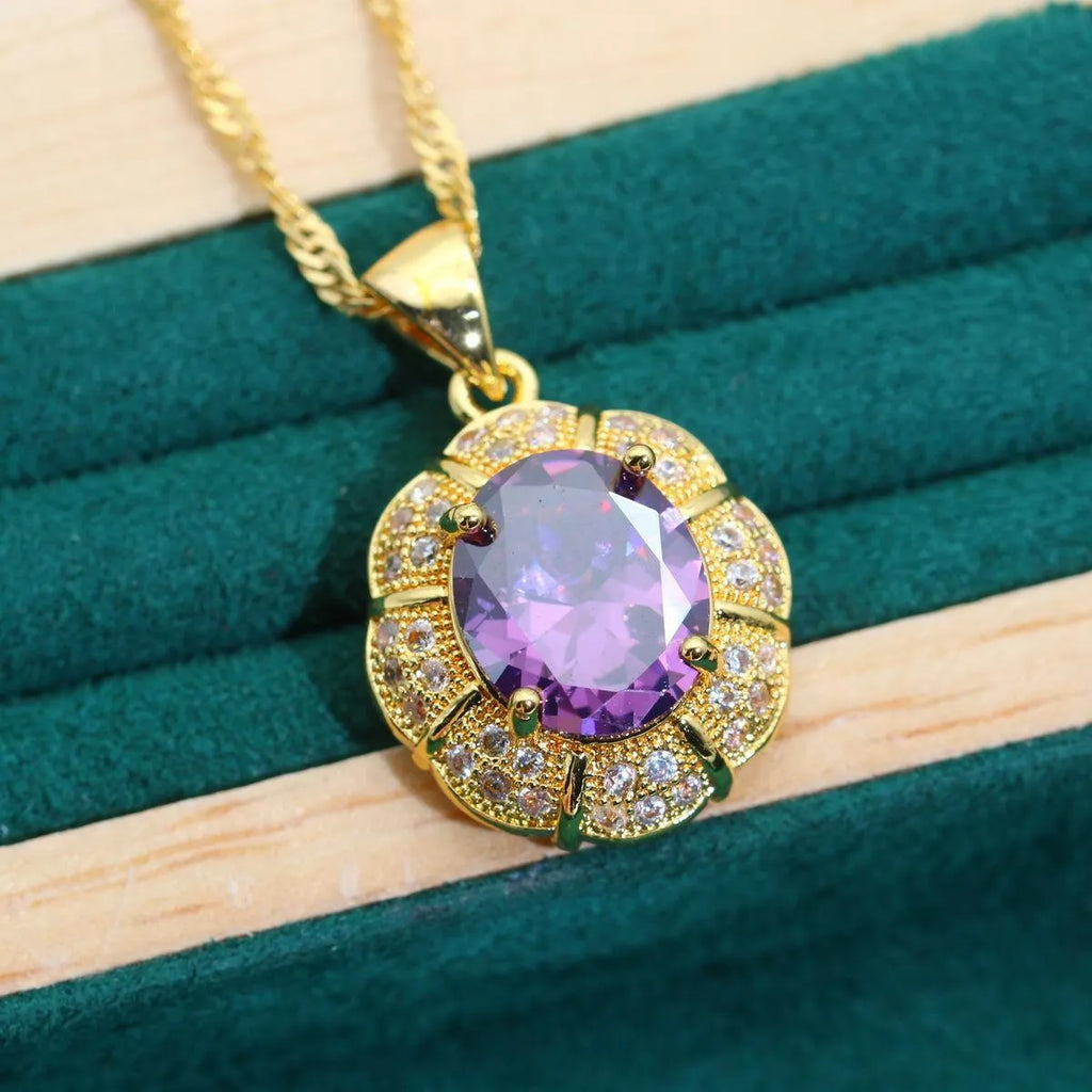 18k gold plated zircon jewellery set showing necklace, earrings, bracelet, and ring with sparkling cubic zirconia stones