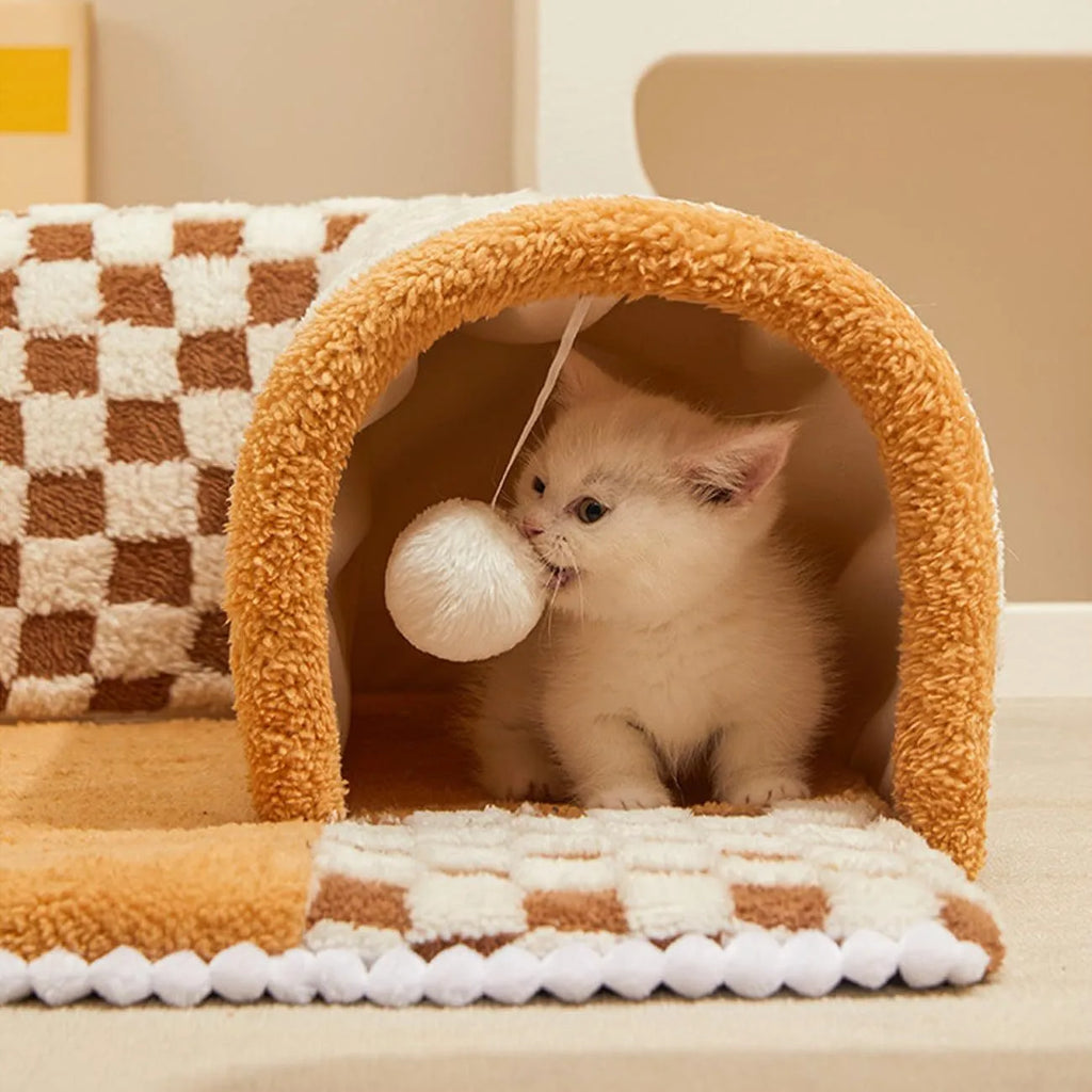 XL coffee coloured plush fan-shaped pet bed with a tunnel for dogs and cats on a wooden floor.
