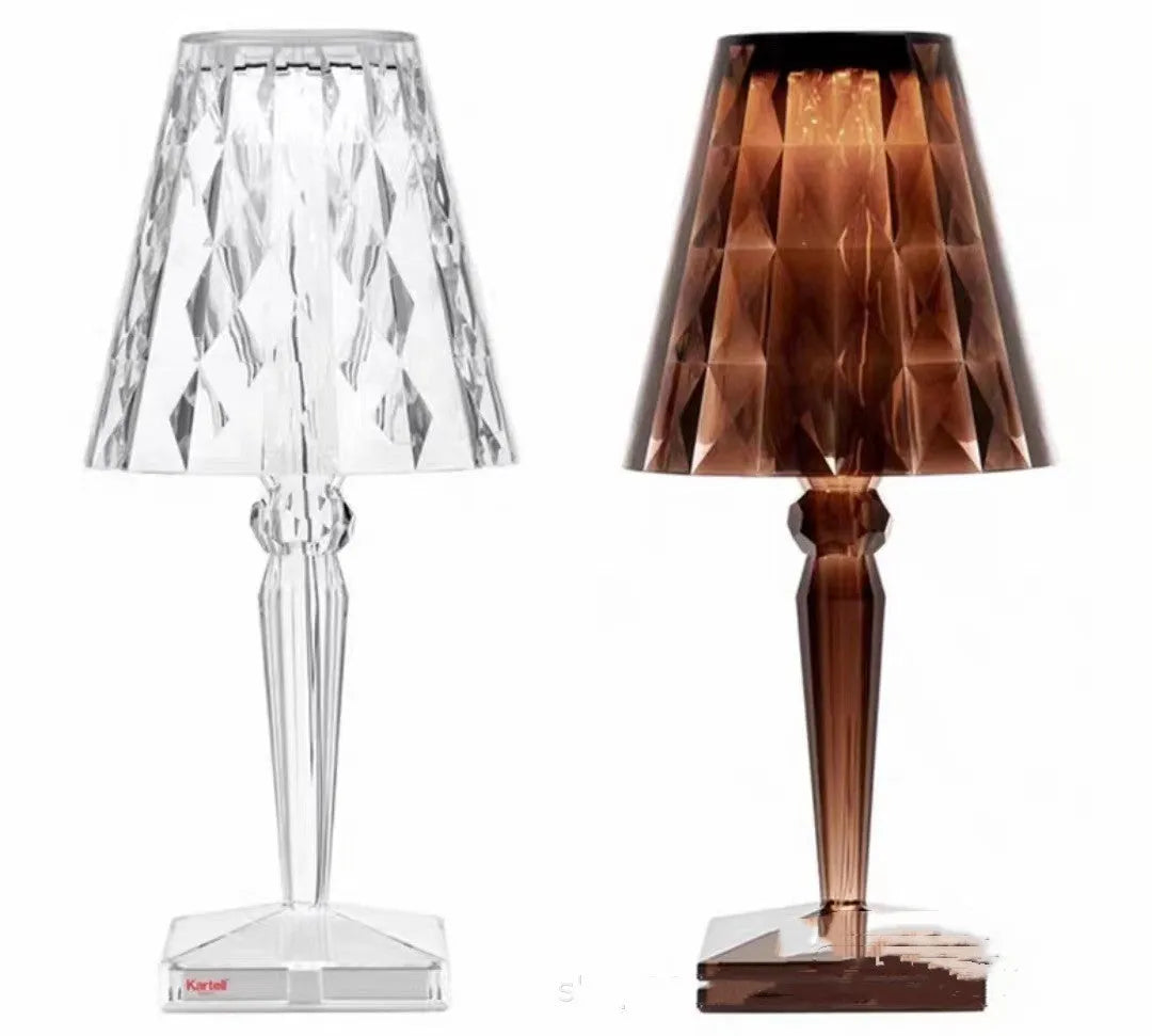 Rose gold portable touch night light with acrylic lamp holder on a surface.