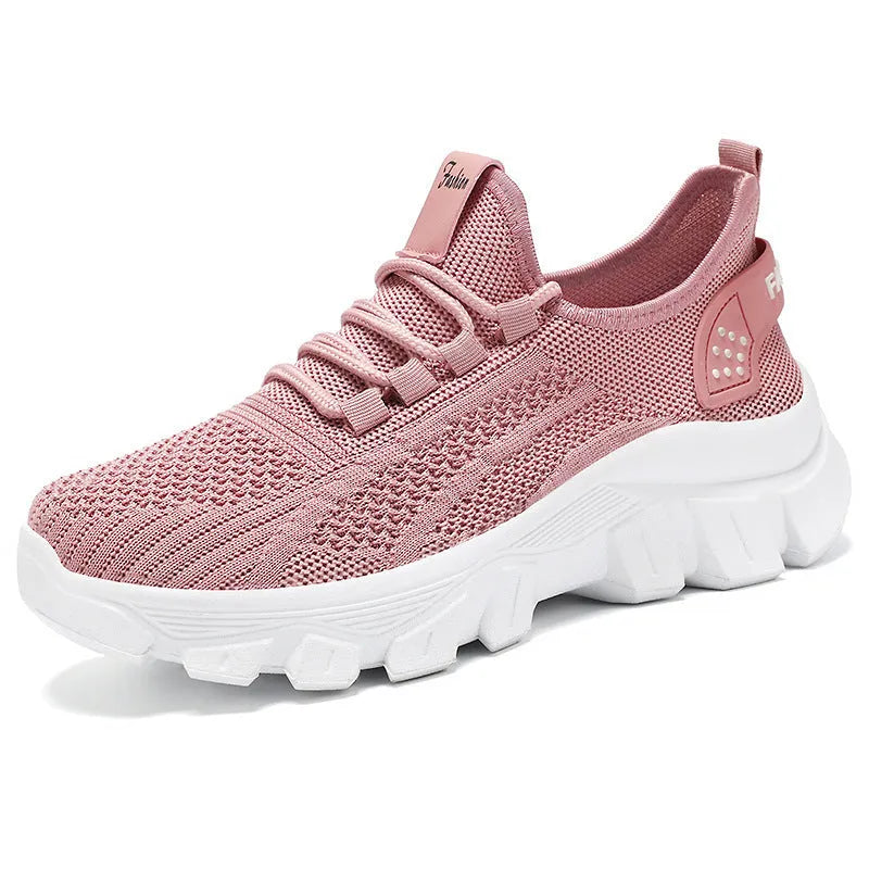 Women's white Flyknit running sneakers with thick PVC sole and lace-up front