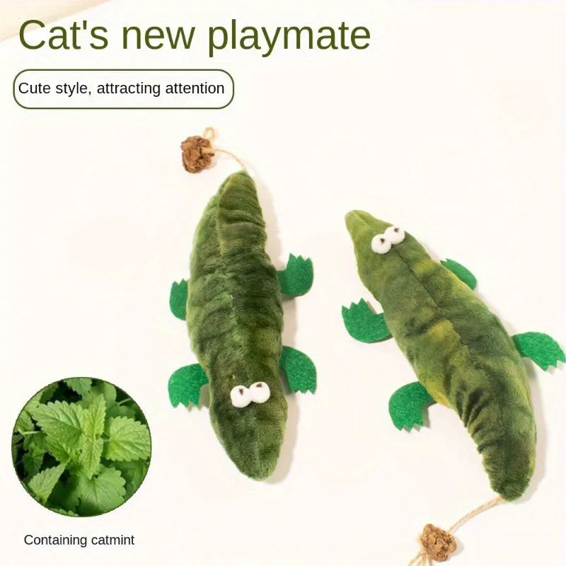 Green plush alligator catnip toy made from cotton fabric on a plain background.