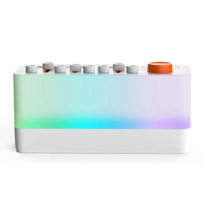 White DIY smart sleep speaker RGB colour small night lamp with alarm and call functions on a bedside table