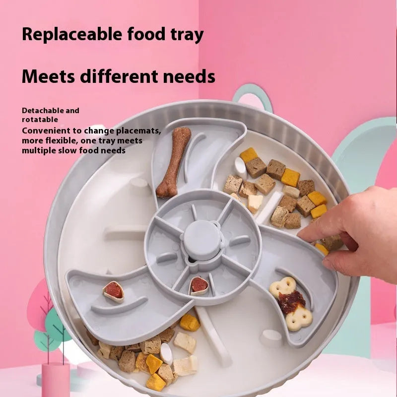 Grey rotating pet slow feeder bowl with a blue silicone windmill-pattern licking mat attached.