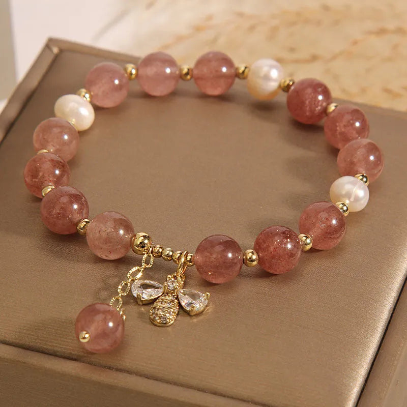 Freshwater pearl and strawberry quartz bracelet with zircon flower charms