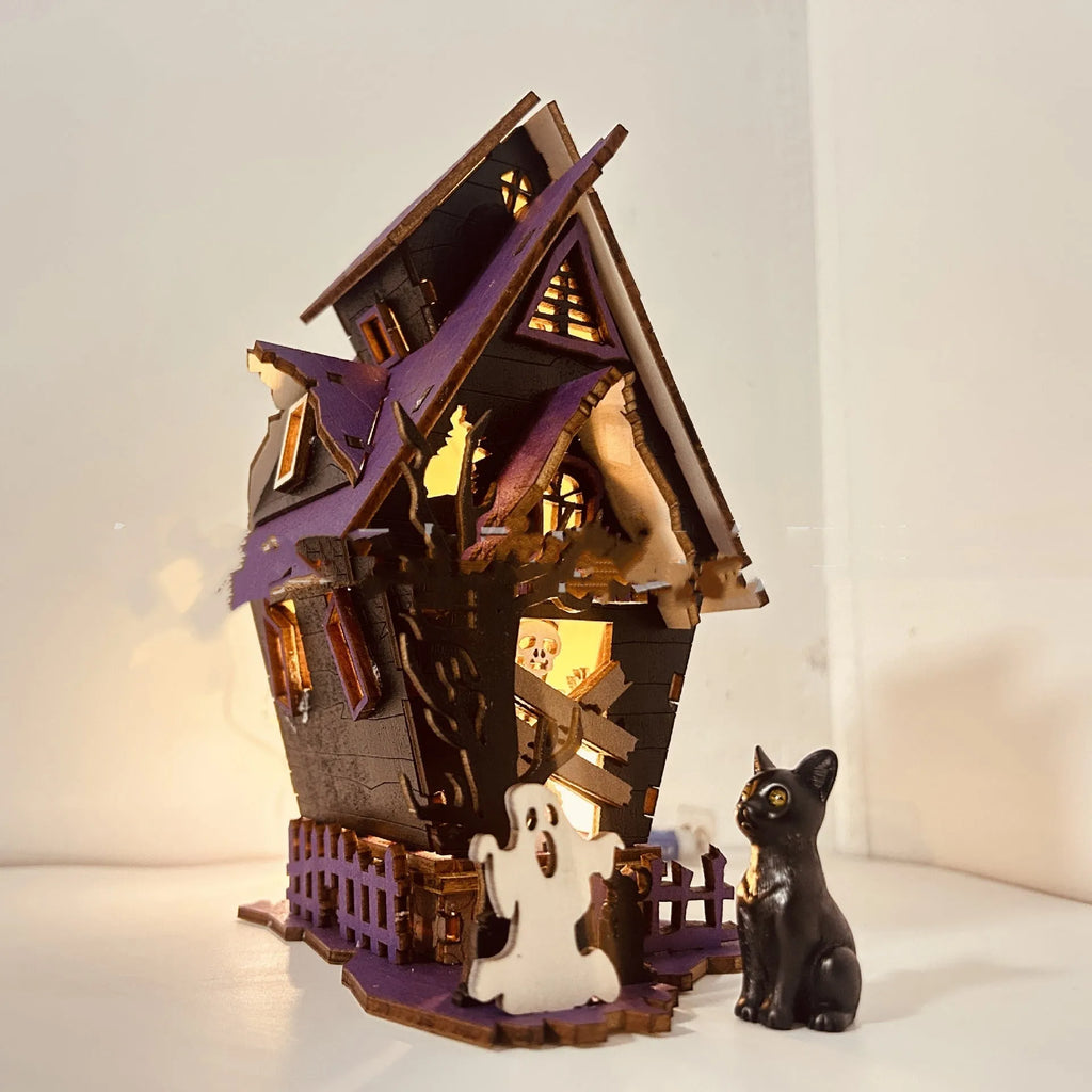 Wooden DIY Halloween haunted house table decoration with glow-in-the-dark details, shown unpainted.