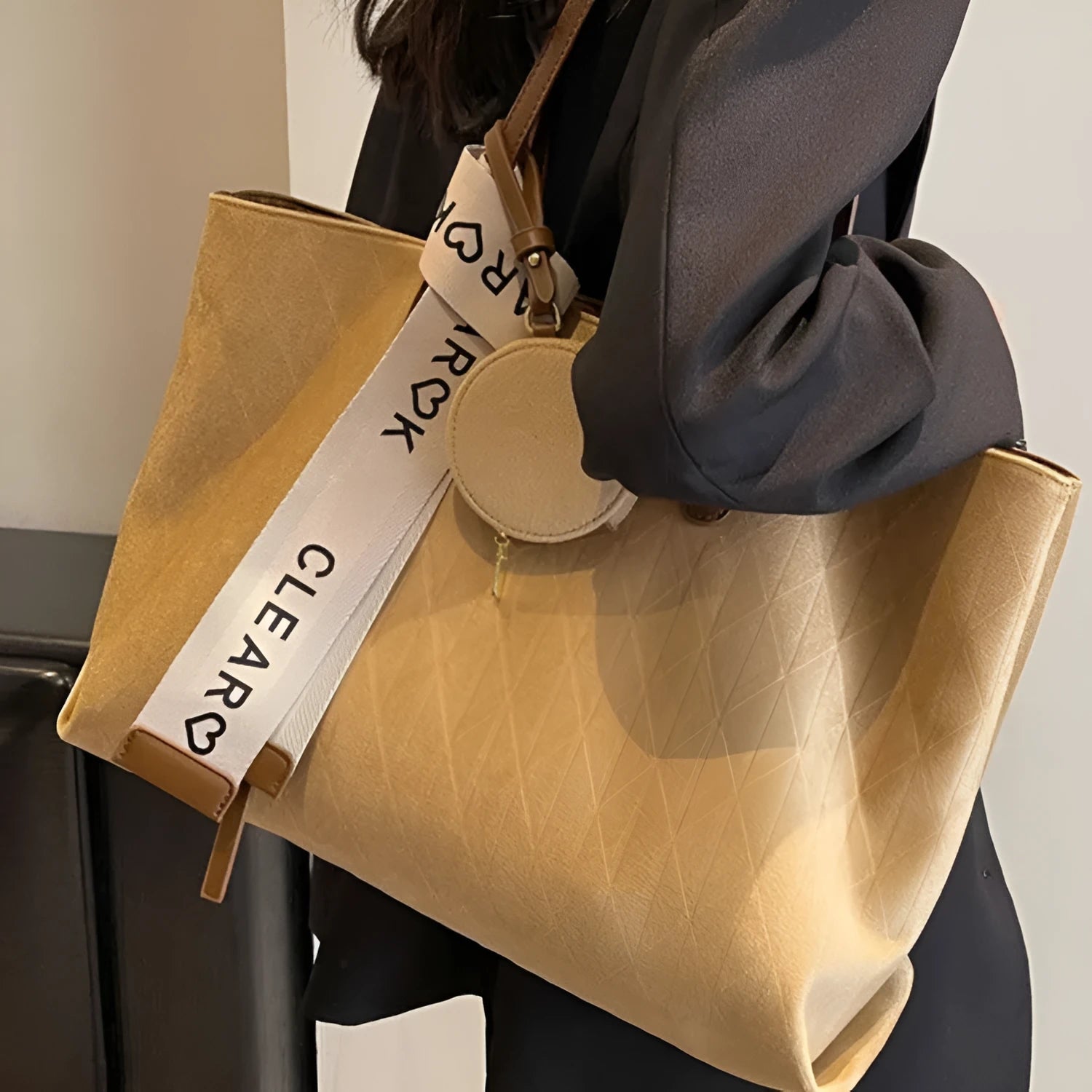 Large polyester shoulder tote bag in horizontal square shape with zipped compartment and sandwich pocket