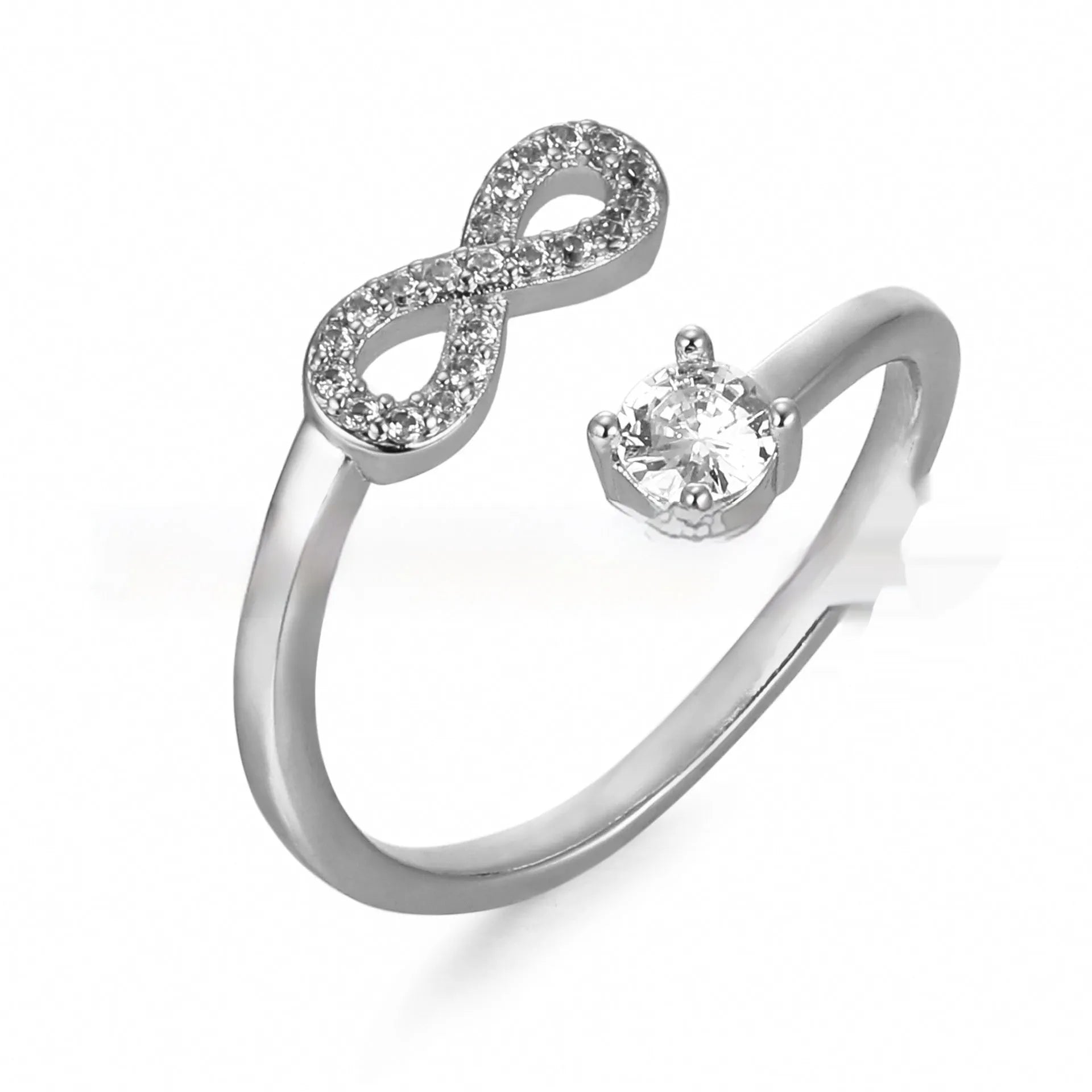 Geometric open metal ring with zircon stones displaying a single letter, available in gold, rose gold, and silver finishes.