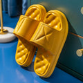 A pair of soft EVA bathroom slippers with a thick non-slip sole, shown in a choice of colours.