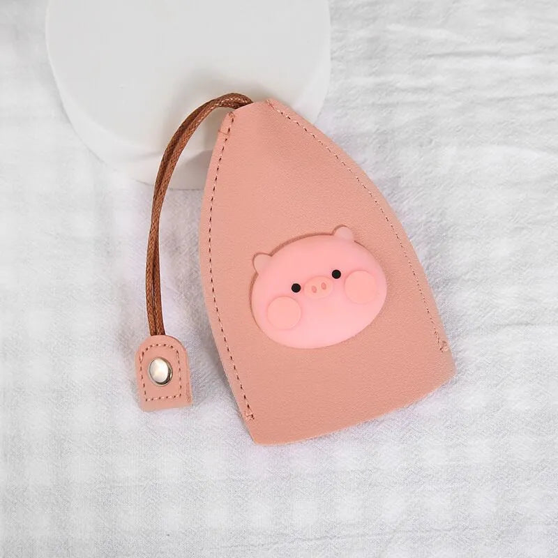 Cartoon pull-out key case in PU leather showing design options including resin fruit and big cartoon animal prints.