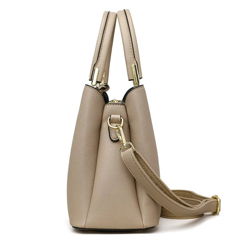 Women's black PU leather shoulder messenger bag with multi-layer compartments and visible stitching details