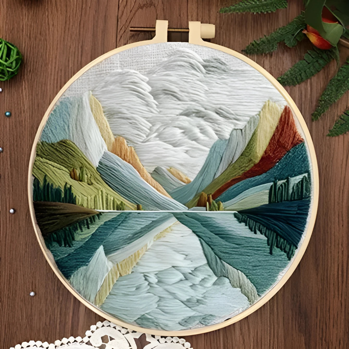 Embroidery DIY kit with printed landscape fabric, embroidery threads, needles, and frame for handmade cloth art