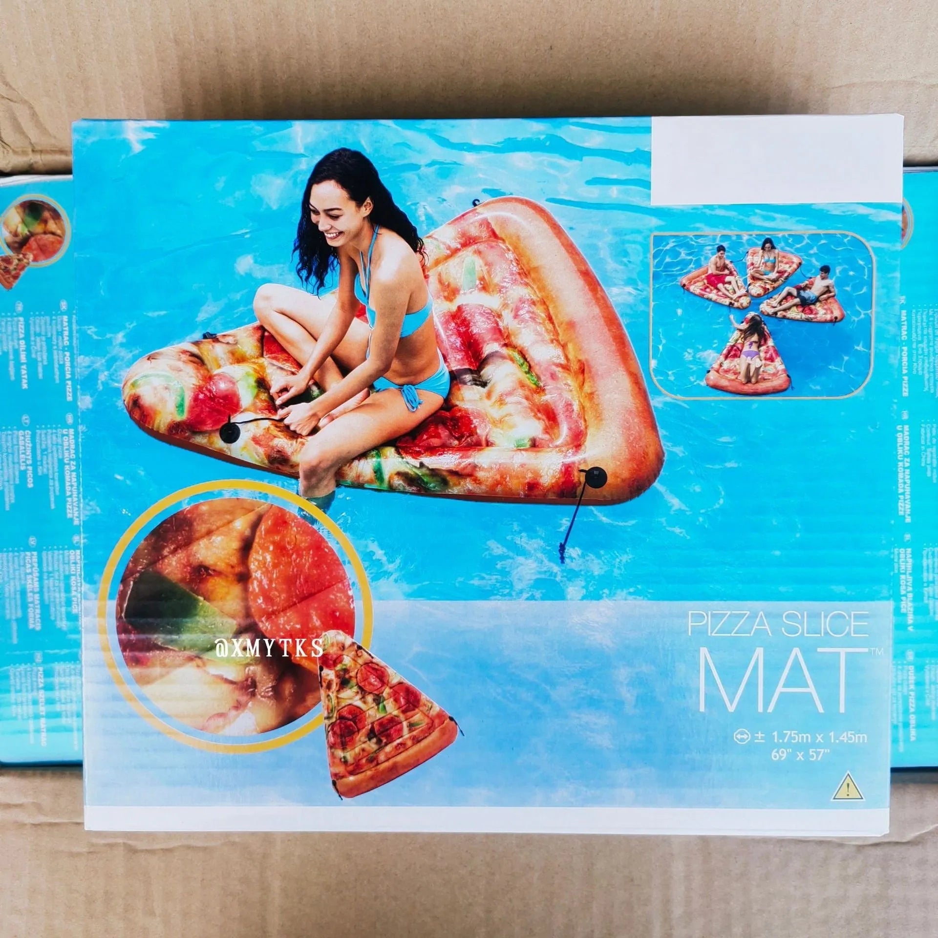 Large green and red pizza slice inflatable surfboard floating on water