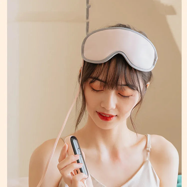 Portable pink eye SPA massage goggles showing suede shell and super fibre padding