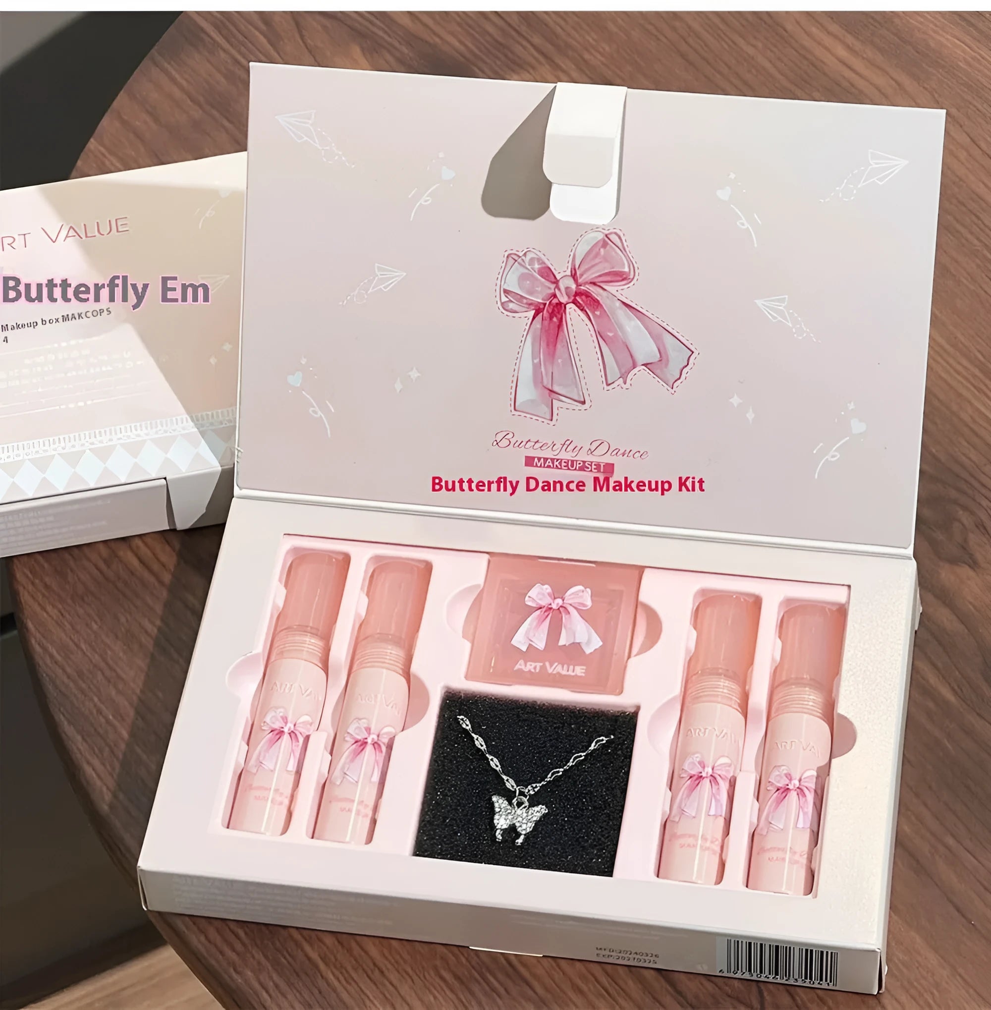 Butterfly Box makeup set with four lip muds, powder blusher and necklace in pink packaging