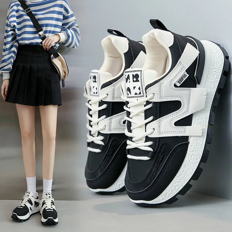 Low-top lace-up sneakers with artificial PU upper and rubber sole in black or white colour