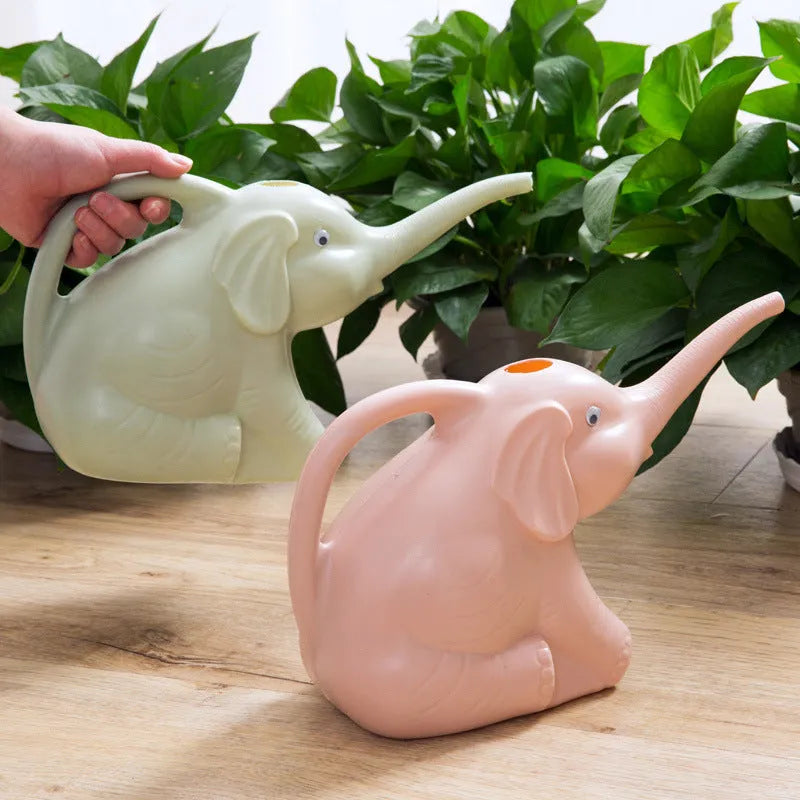 Pink elephant-shaped children's watering can with a long nozzle and bottle-style handle.