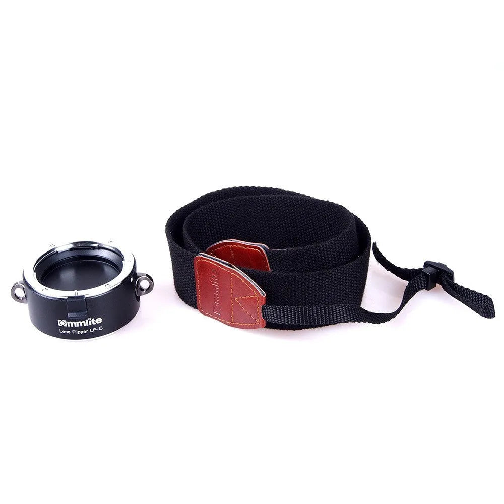 Aluminium lens flipper for Nikon E-Mount cameras with cotton shoulder strap showing double lens holder design