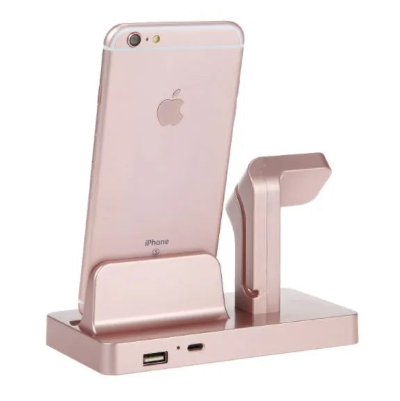 White 2-in-1 charging dock holding an iPhone and an Apple Watch on a wooden desk.
