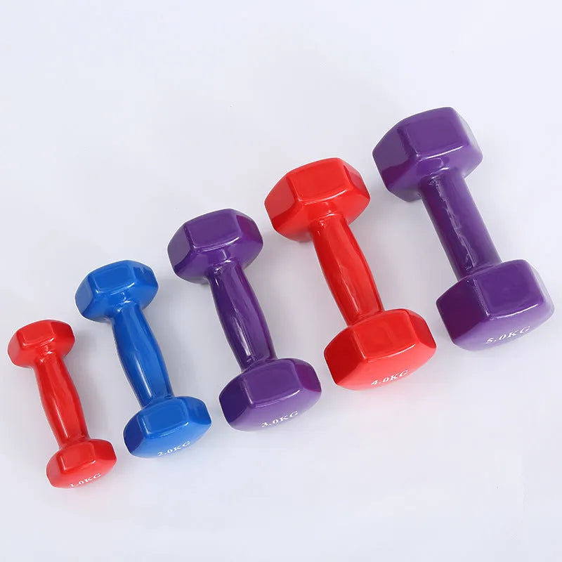 Colourful plastic fitness dumbbells in bright colours with glossy surface coating