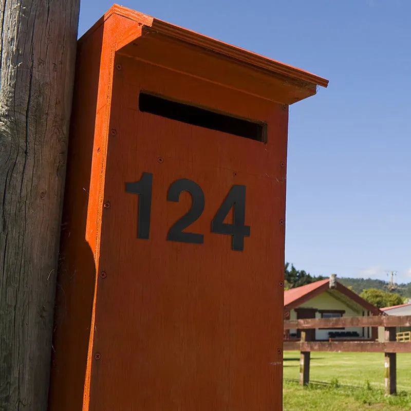 Black stainless steel sticky adhesive house number showing character size of 7.5cm.