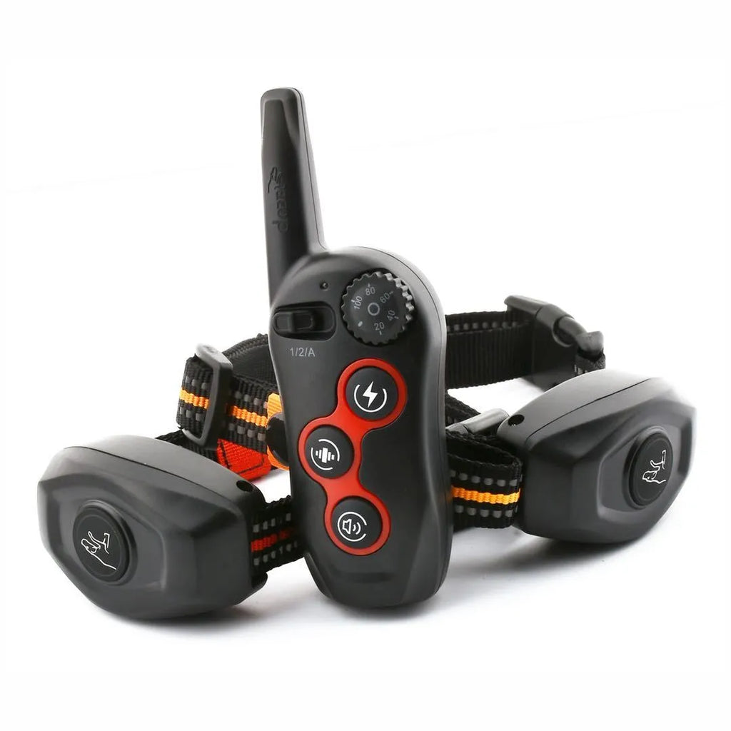 Dog training clicker in orange colour with attached white wrist strap on a white background