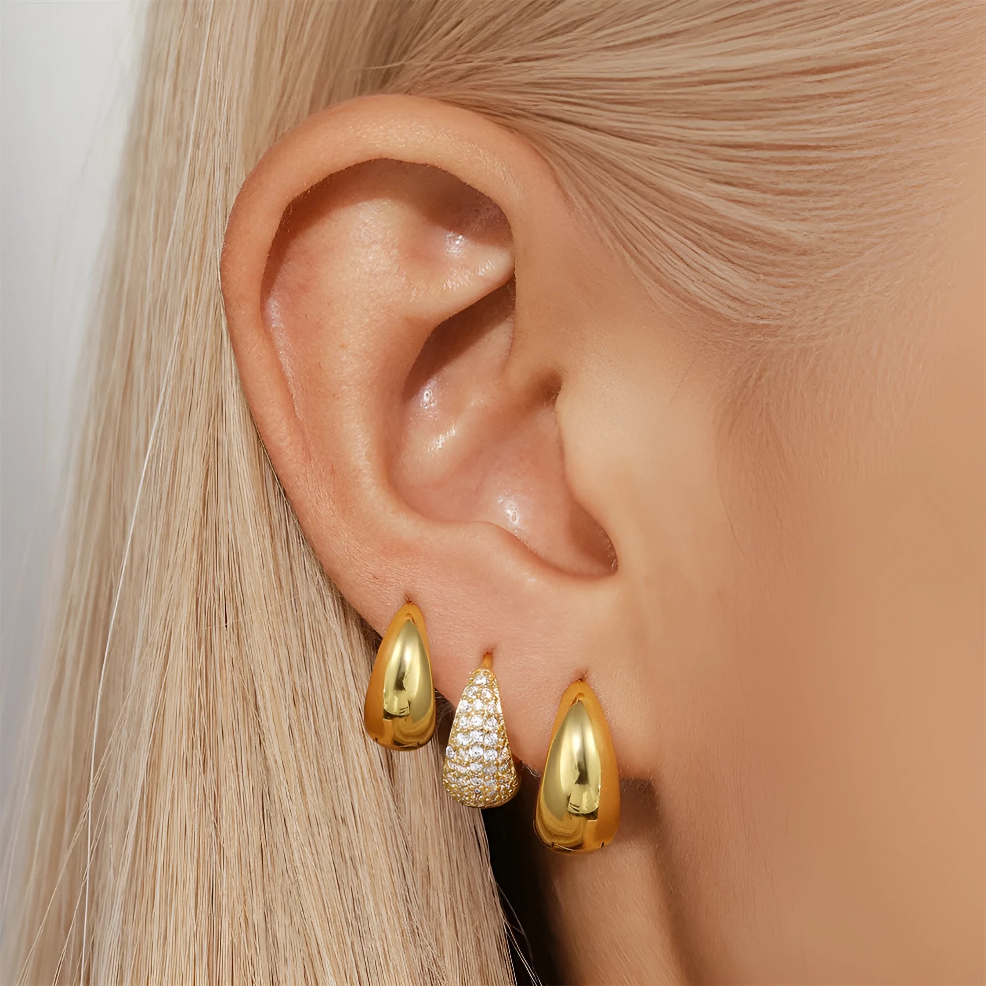 Gold electroplated brass earclip earrings with geometric round design in three style options