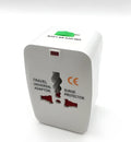 A compact white universal travel plug converter on a plain background.