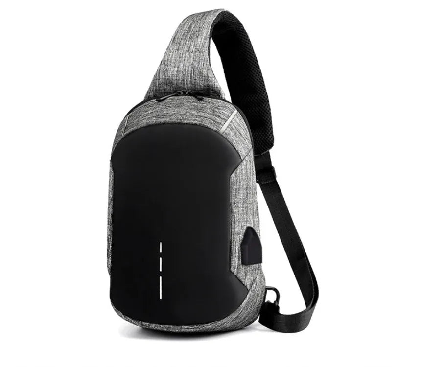 Small dark blue oxford cloth waterproof chest bag with a single strap and zipper.
